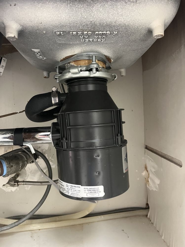 Badger disposal installed under Kohler sink — neat and reliable
