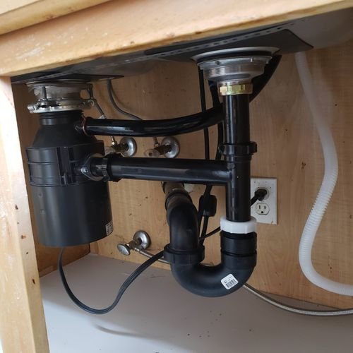 New garbage disposal installation in tight under-sink space